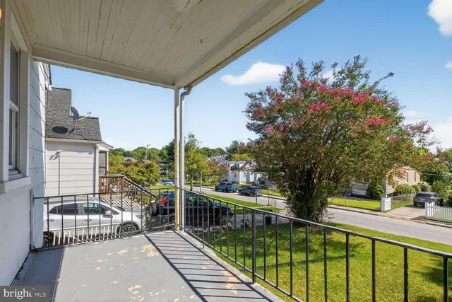 a view of a balcony with chairs