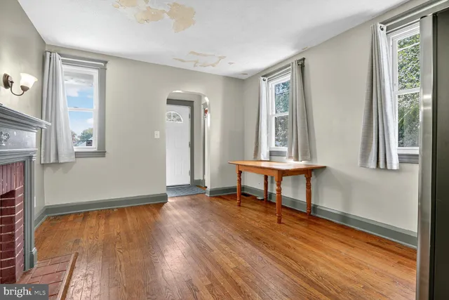 a view of a livingroom with furniture and a window