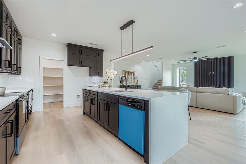 12 Climbing Tree Drive Kaufman, TX 75142 - Photo 9 of 28 a large kitchen with stainless steel appliances a sink and cabinets