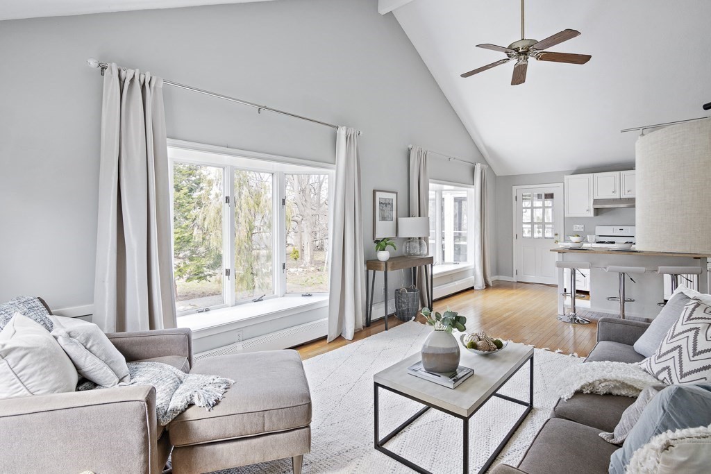 a living room with furniture and a window