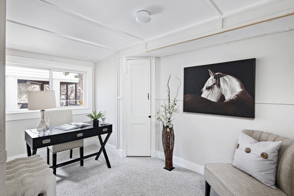 206 West Street Reading, MA 01867 - Photo 12 of 28 a living room with furniture and a painting on the wall