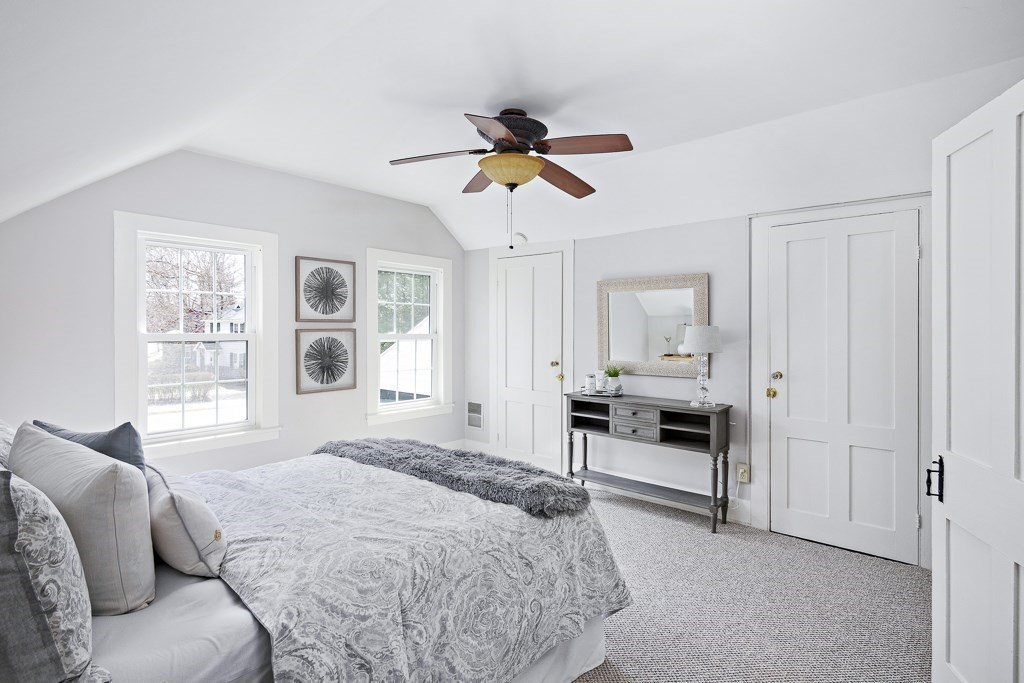 206 West Street Reading, MA 01867 - Photo 16 of 28 a bedroom with a bed and a window