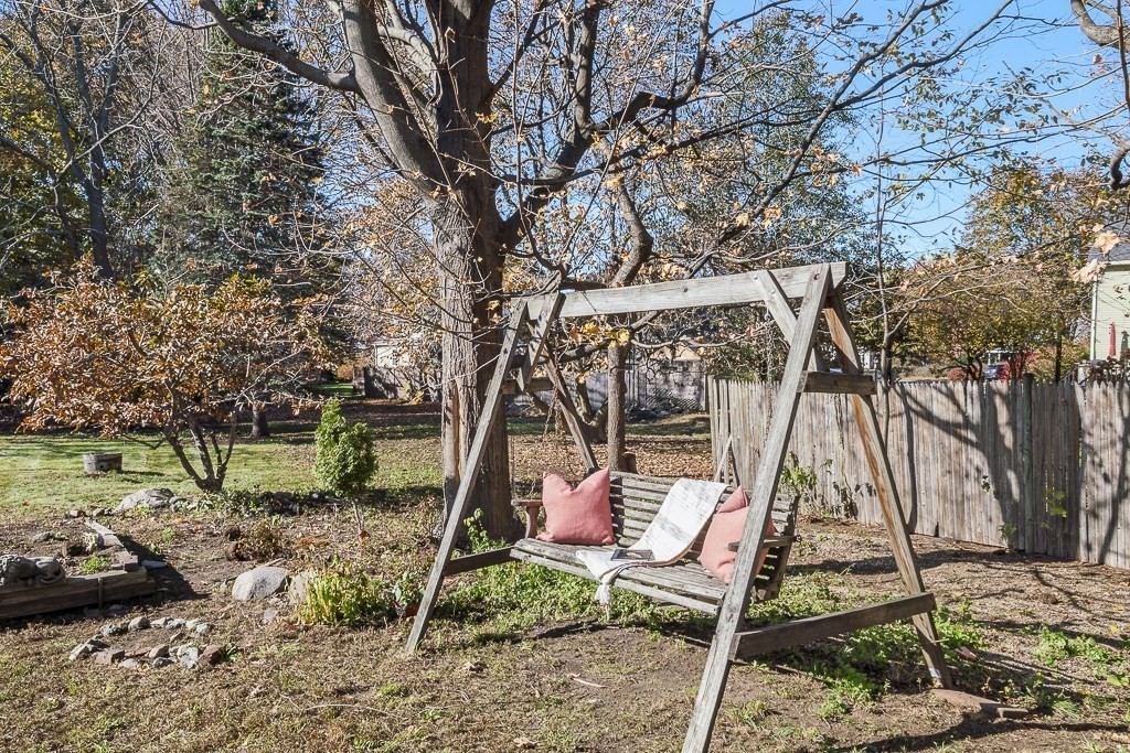 206 West Street Reading, MA 01867 - Photo 21 of 28 a backyard of a house with lots of green space