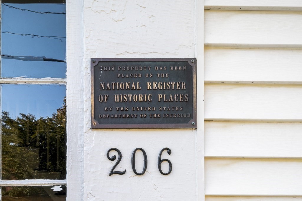206 West Street Reading, MA 01867 - Photo 28 of 28 a sign that is on the side of a building