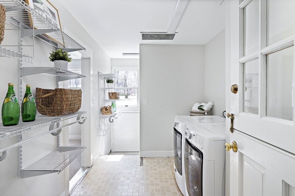 206 West Street Reading, MA 01867 - Photo 8 of 28 a utility room with dryer and washer