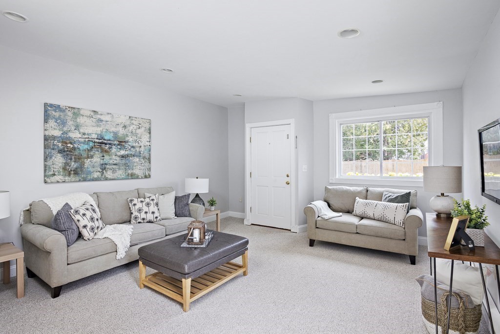 206 West Street Reading, MA 01867 - Photo 9 of 28 a living room with furniture rug and window
