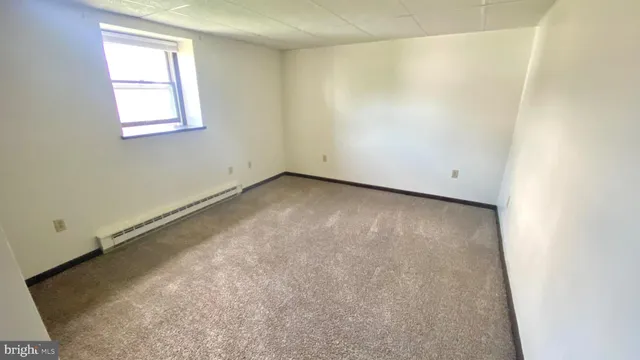 an empty room with a windows