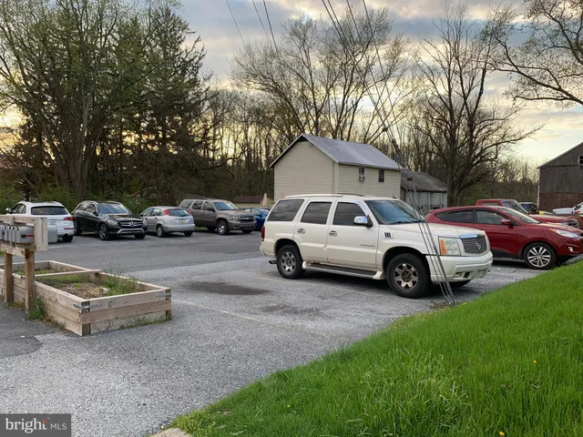 a view of a cars parked in front of a house