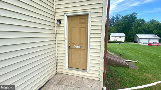 a view of a door front of the house