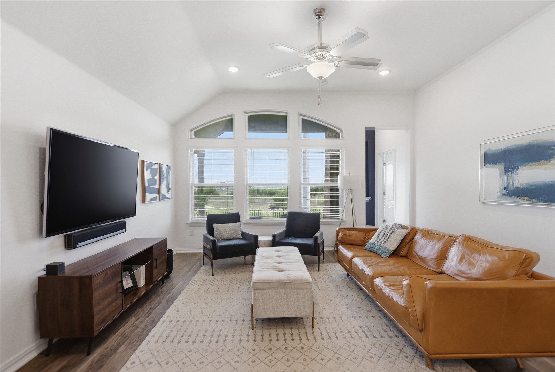 544 Cherrystone Loop Buda, TX 78610 - Photo 6 of 40 a living room with furniture and a flat screen tv