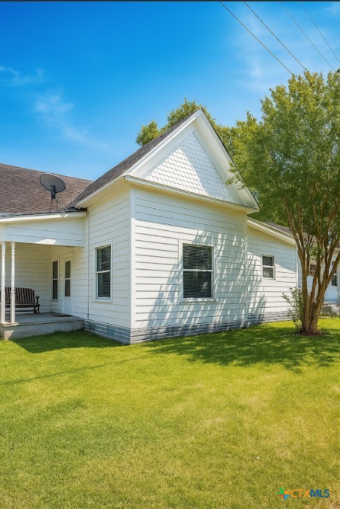 202 Clark Street Yoakum, TX 77995 - Photo 14 of 15 a view of a house with a yard