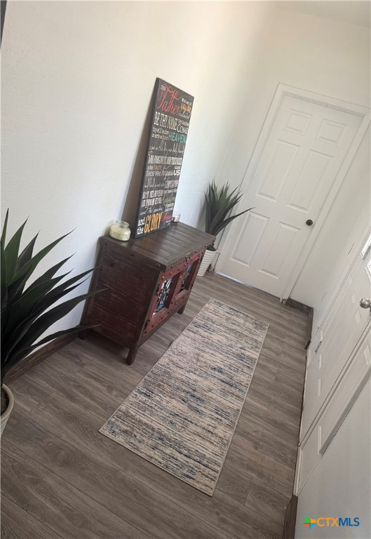 202 Clark Street Yoakum, TX 77995 - Photo 5 of 15 a view of an empty room with wooden floor