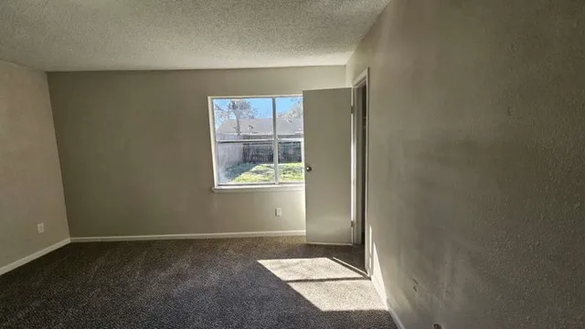 a view of an empty room and window