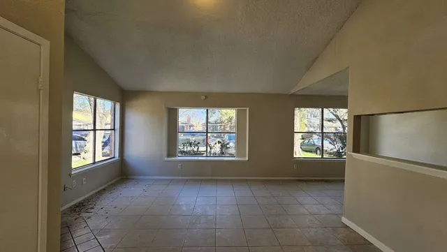 an empty room with windows