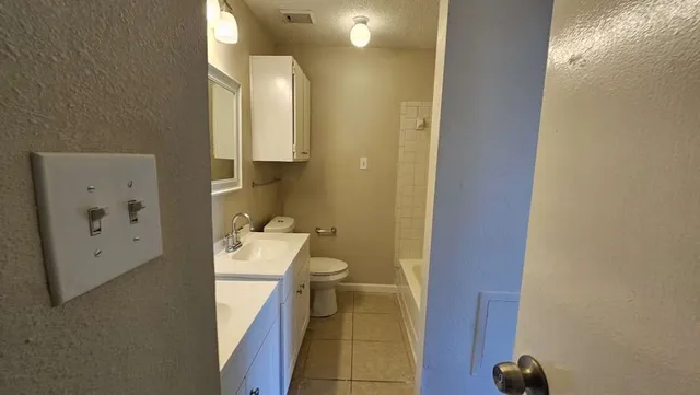 a bathroom with a sink and toilet