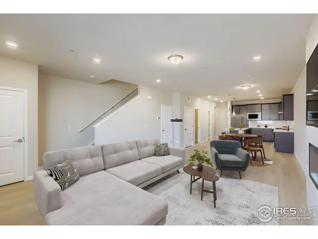 a kitchen with granite countertop a sink a counter top space stainless steel appliances and cabinets