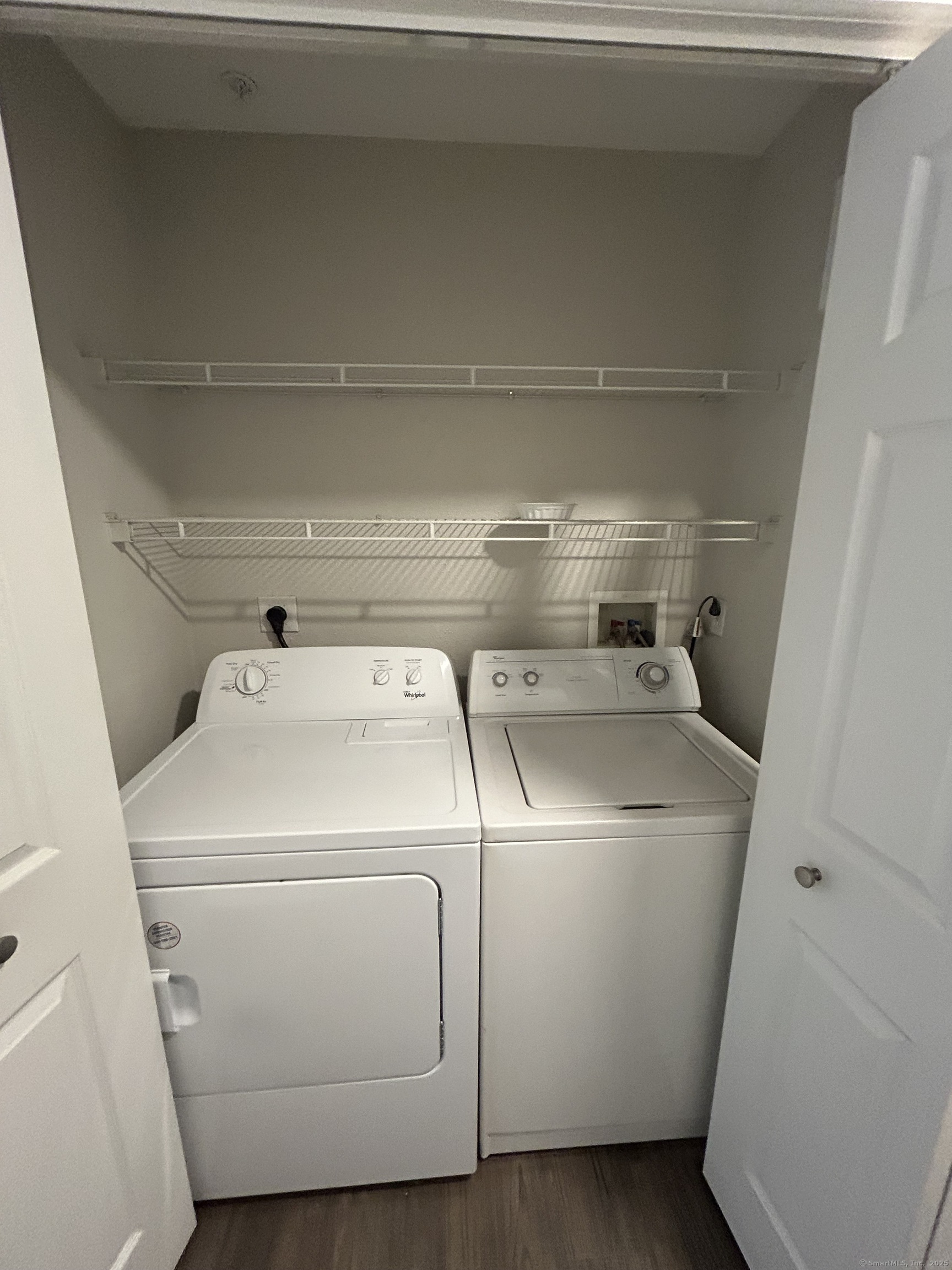 138 Hollow Tree Ridge Road, Unit 1802 Darien, CT 06820 - Photo 11 of 30 a utility room with dryer and washer