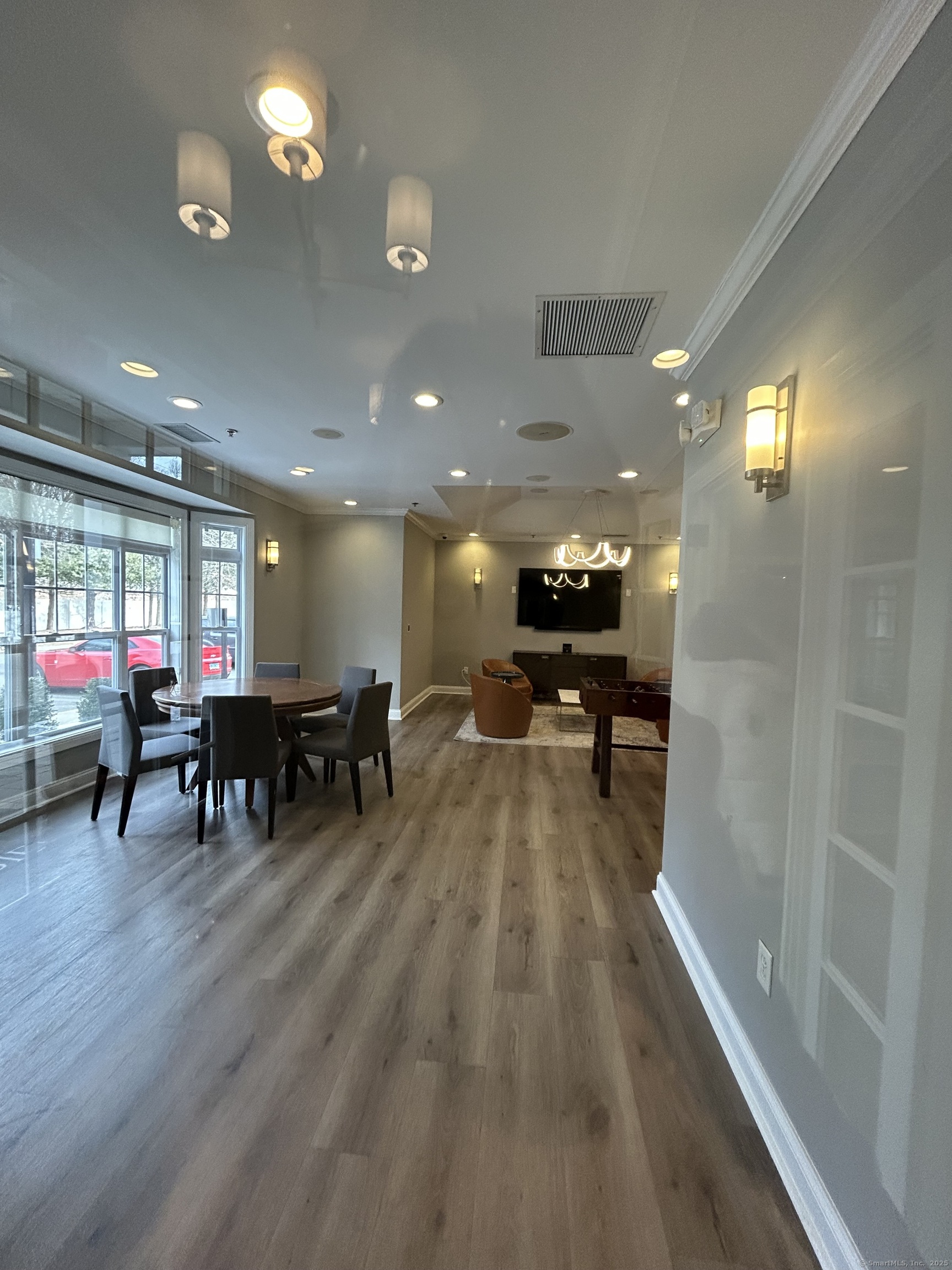 138 Hollow Tree Ridge Road, Unit 1802 Darien, CT 06820 - Photo 21 of 30 a lobby with furniture and a table