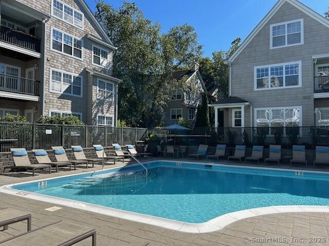 138 Hollow Tree Ridge Road, Unit 1802 Darien, CT 06820 - Photo 26 of 30 a front view of building with outdoor space