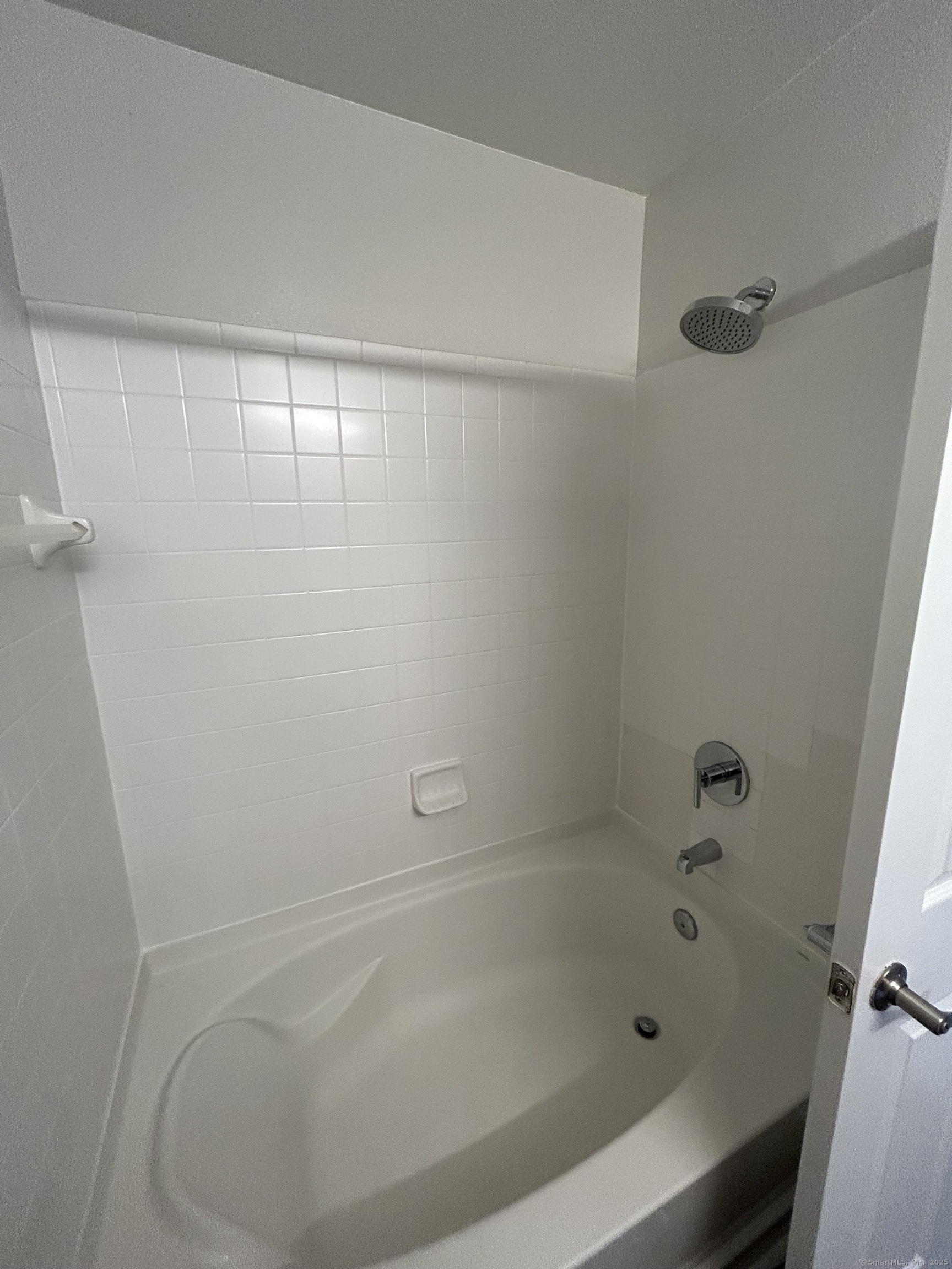 138 Hollow Tree Ridge Road, Unit 1802 Darien, CT 06820 - Photo 8 of 30 a close up of a bathtub in a bathroom