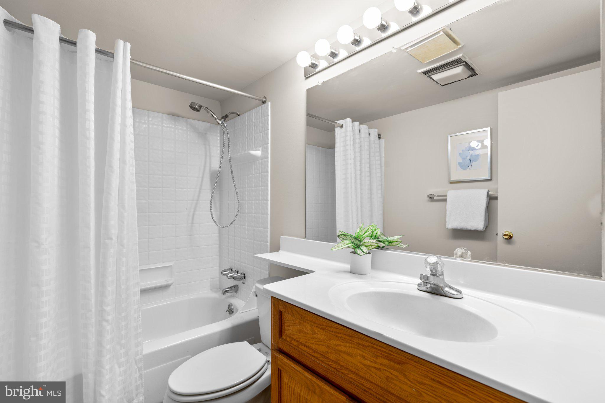 5907 Tamar Drive, Unit 7 R7 Columbia, MD 21045 - Photo 13 of 23 a bathroom with a sink toilet and shower
