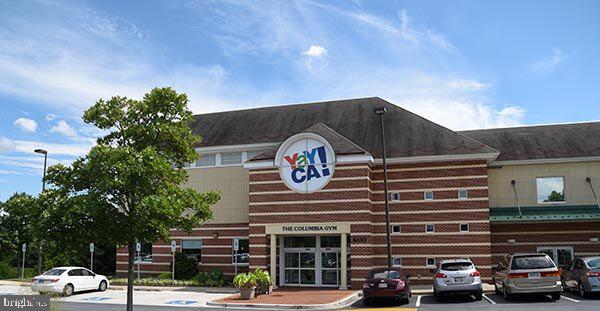 5907 Tamar Drive, Unit 7 R7 Columbia, MD 21045 - Photo 20 of 23 a front view of a building with parking space