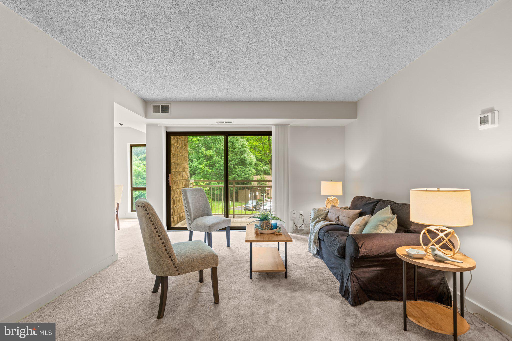 5907 Tamar Drive, Unit 7 R7 Columbia, MD 21045 - Photo 3 of 23 a living room with furniture and a window