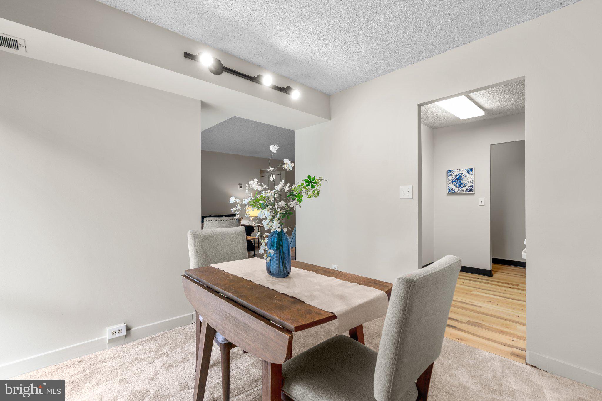 5907 Tamar Drive, Unit 7 R7 Columbia, MD 21045 - Photo 6 of 23 a dining room with furniture and wooden floor