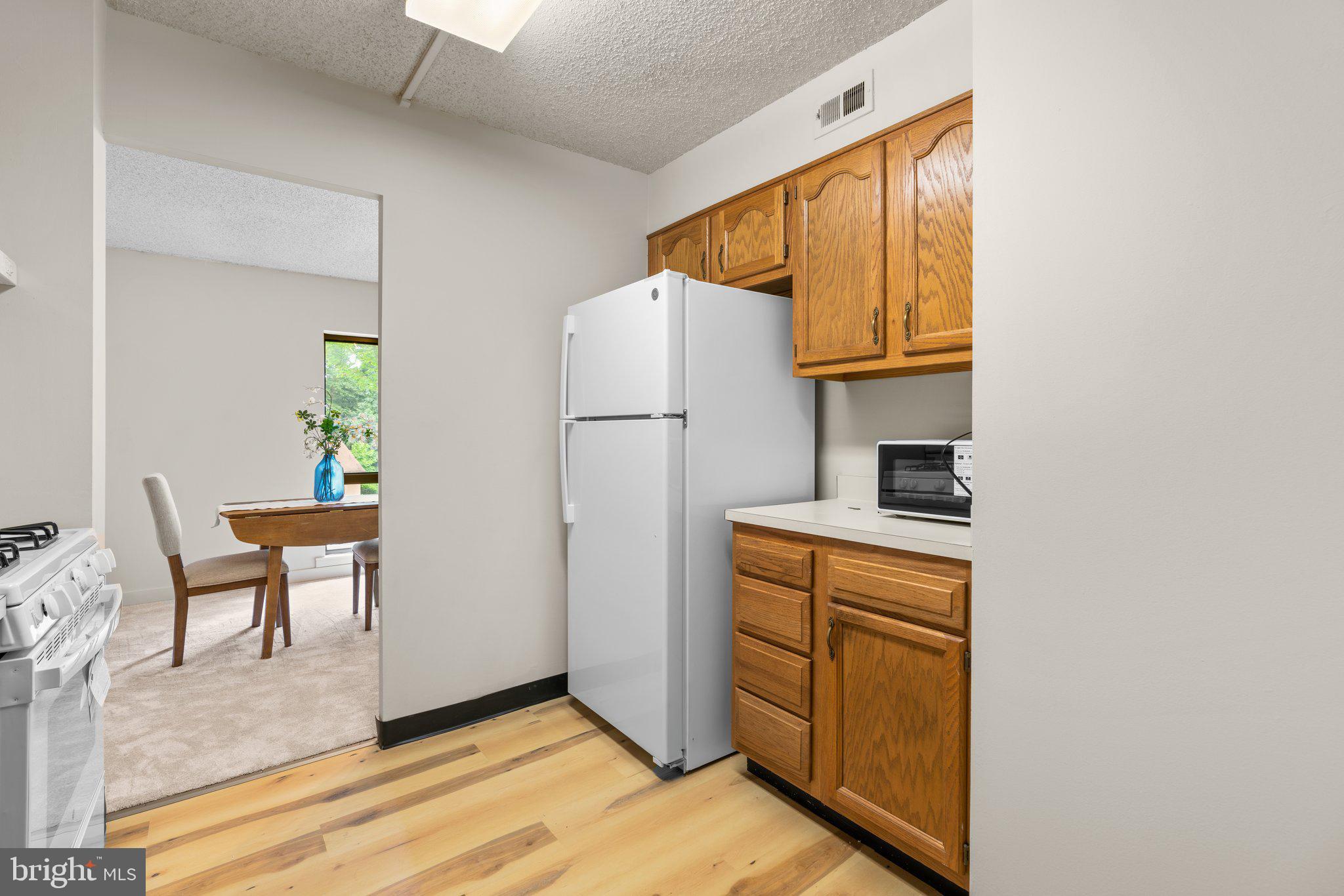5907 Tamar Drive, Unit 7 R7 Columbia, MD 21045 - Photo 10 of 23 a view of kitchen with furniture and refrigerator