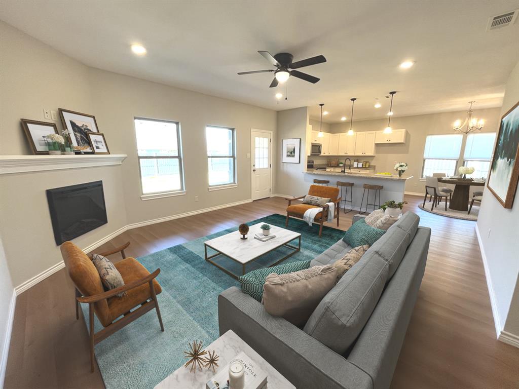 316 James Street Mabank, TX 75147 - Photo 3 of 20 a living room with furniture and a wooden floor