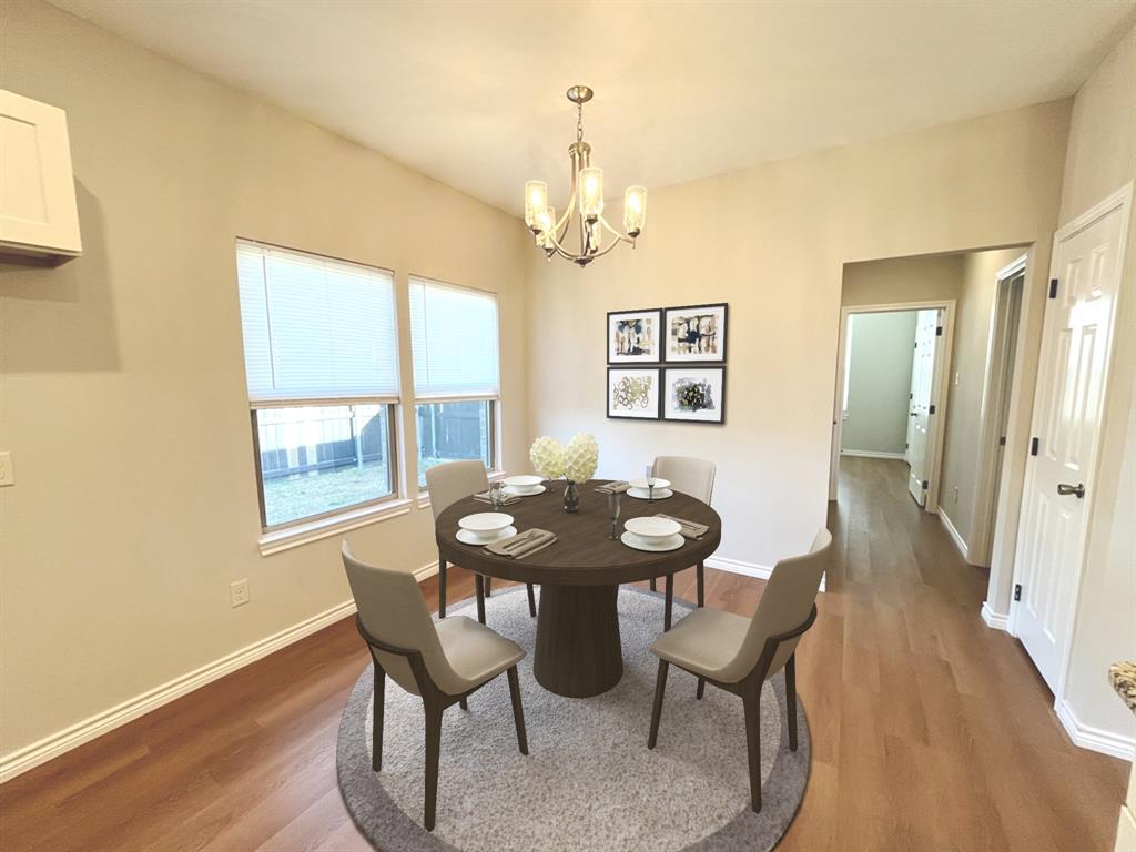 316 James Street Mabank, TX 75147 - Photo 8 of 20 a view of a dining room with furniture window and wooden floor
