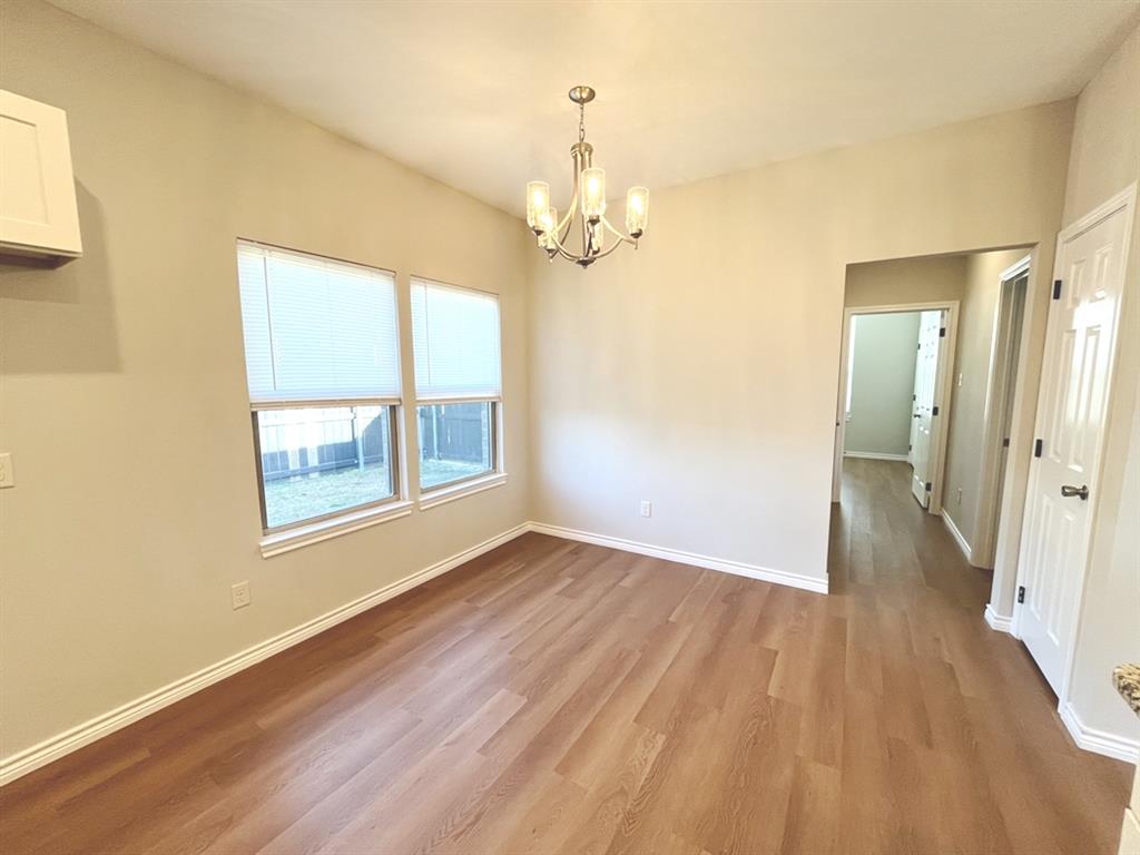 316 James Street Mabank, TX 75147 - Photo 9 of 20 a view of livingroom with hardwood floor and window