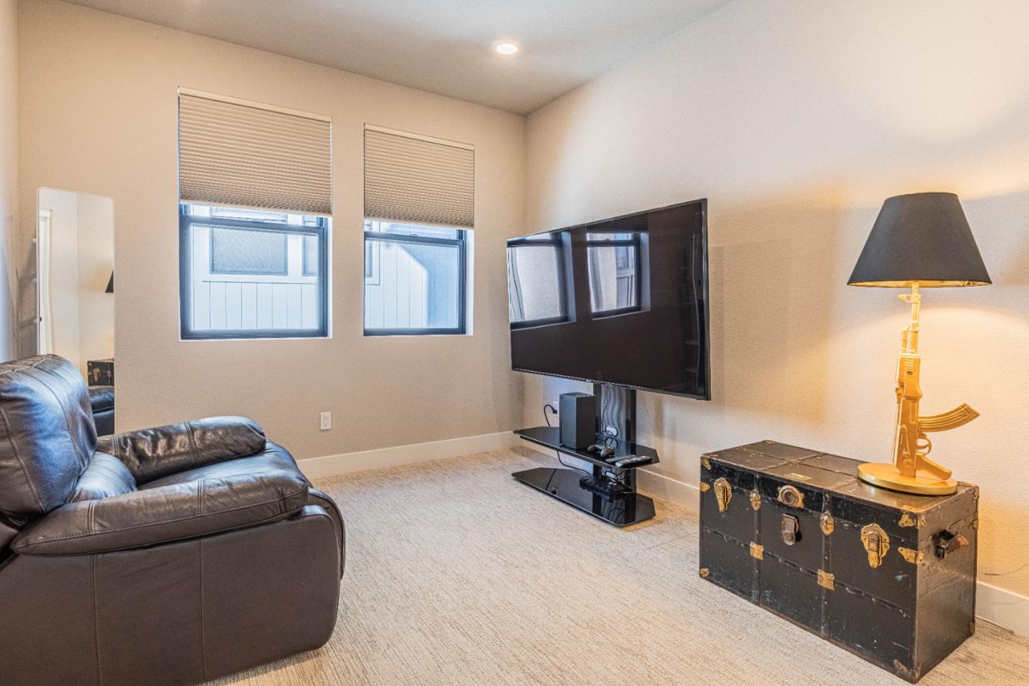 135 8th Street Marina, CA 93933 - Photo 47 of 69 a living room with furniture and a lamp