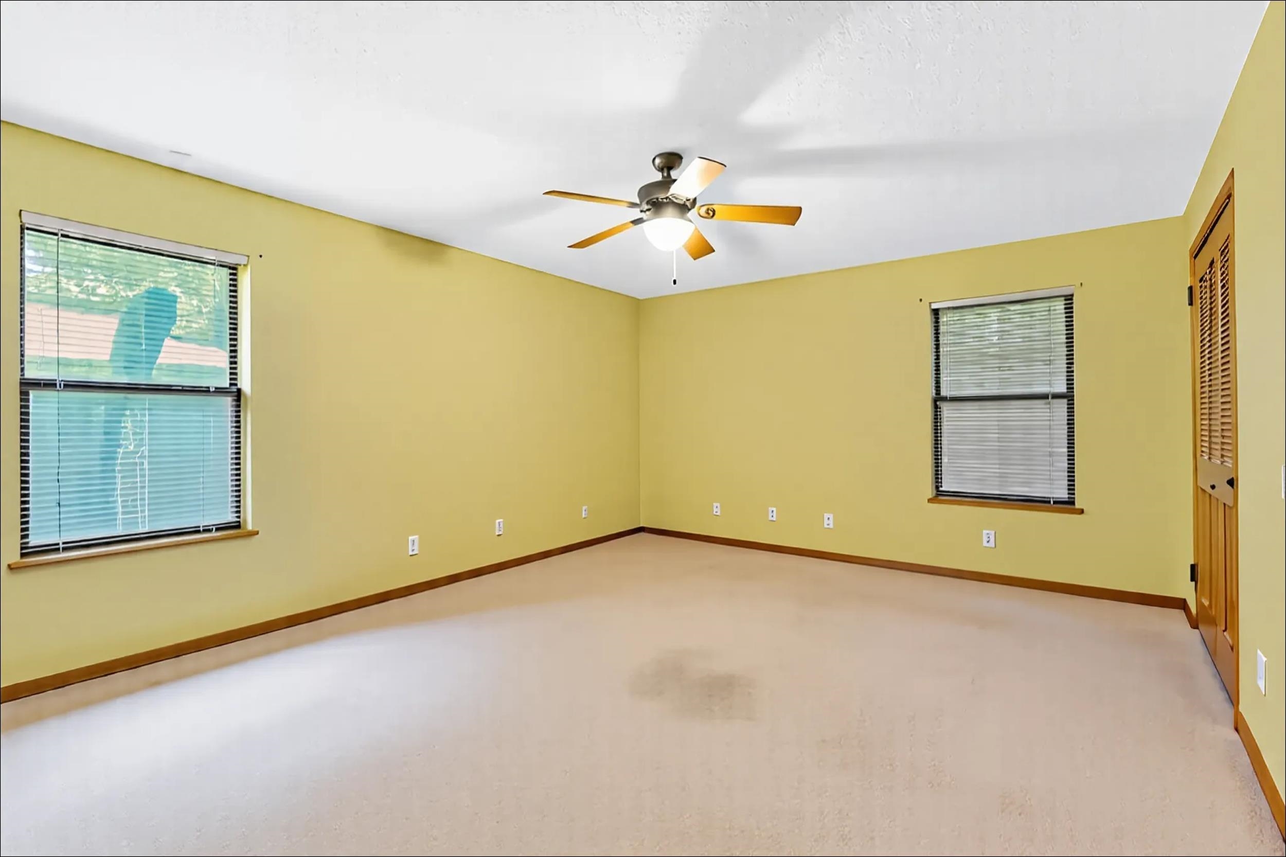426 Jasmine Road St. Augustine, FL 32086 - Photo 13 of 18 an empty room with a window and ceiling fan