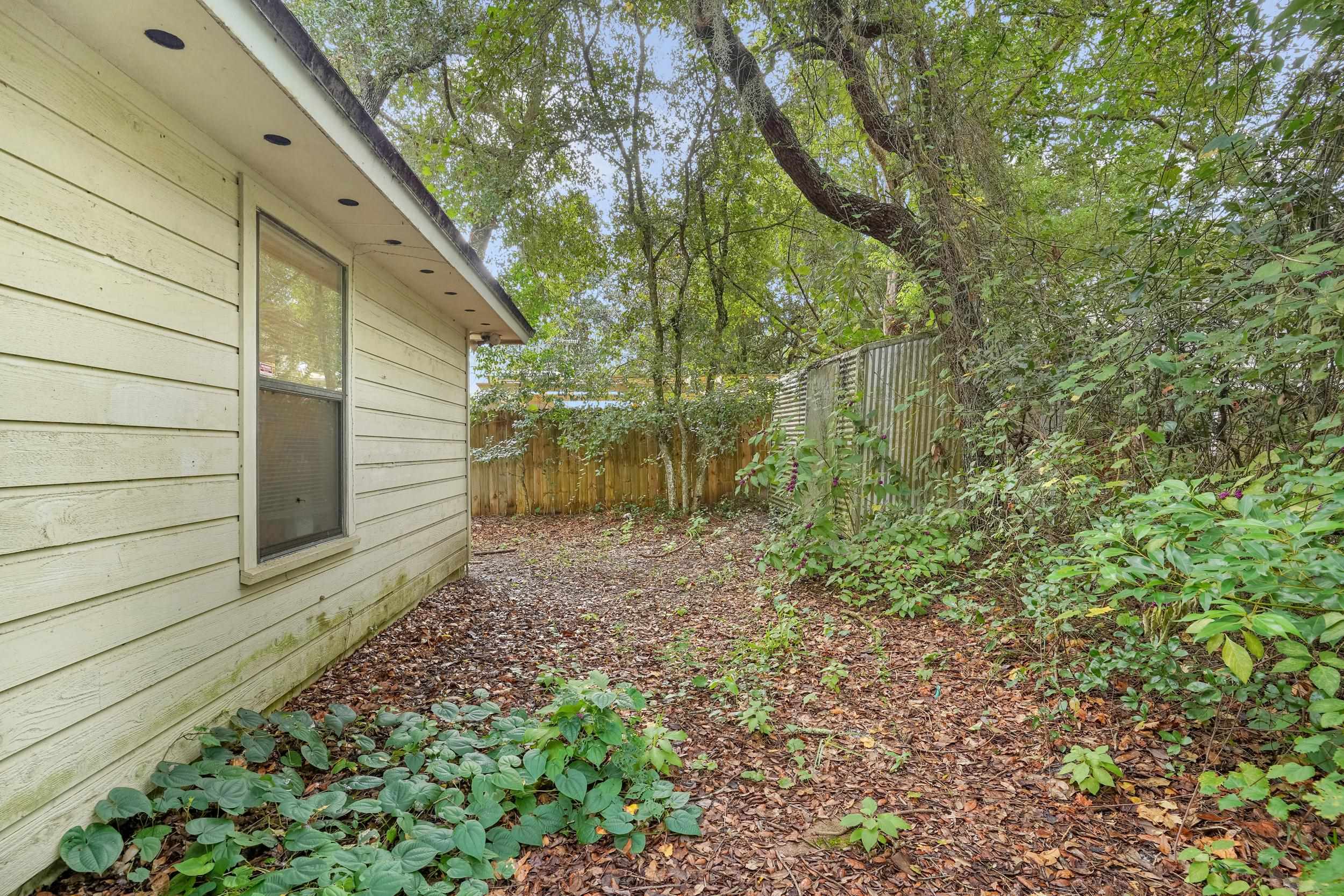 426 Jasmine Road St. Augustine, FL 32086 - Photo 18 of 18 a backyard of a house with lots of green space