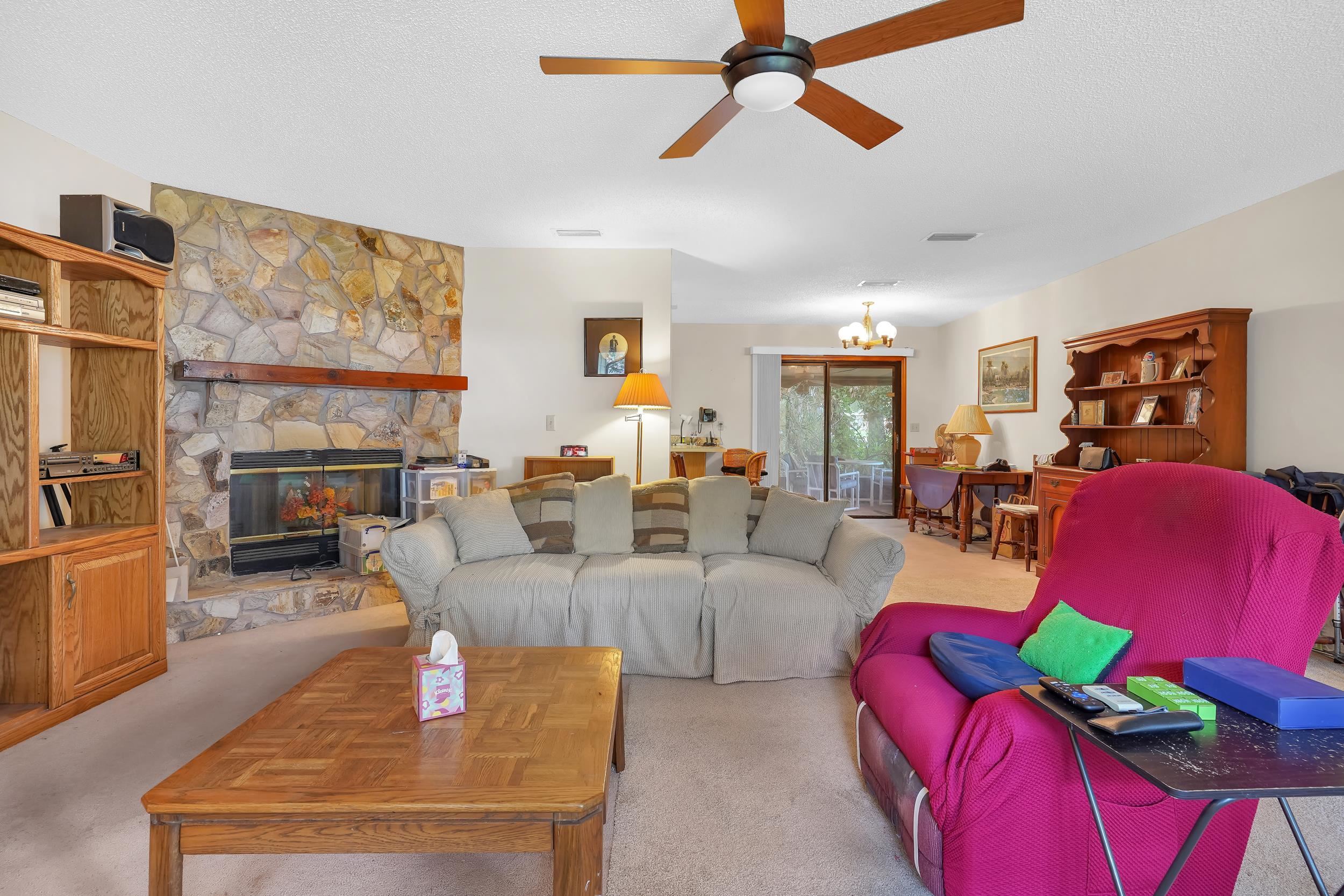 426 Jasmine Road St. Augustine, FL 32086 - Photo 6 of 18 a living room with fireplace furniture and a flat screen tv