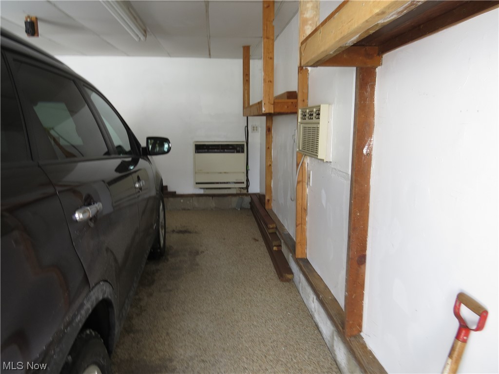 641 Schocalog Road Akron, OH 44320 - Photo 31 of 33 Garage with a wall unit AC and heater