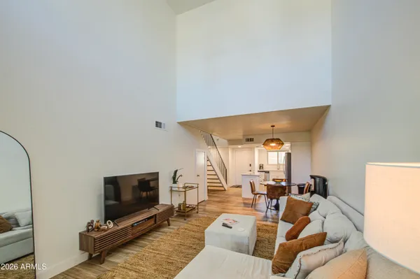 a bedroom with a bed and a television