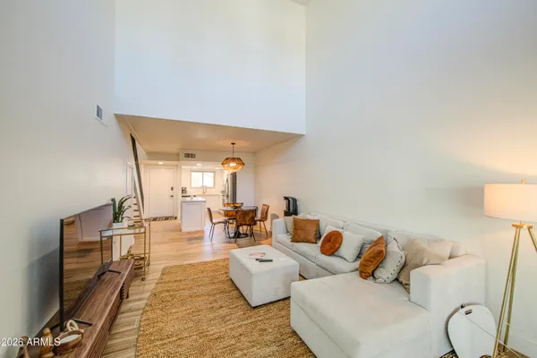 a bedroom with a bed and a lamp