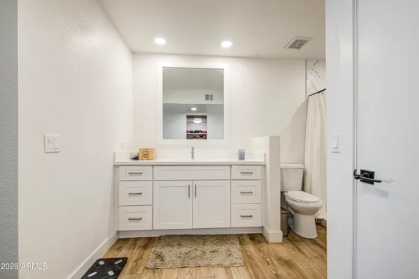 a front view of a house with a yard and a garage