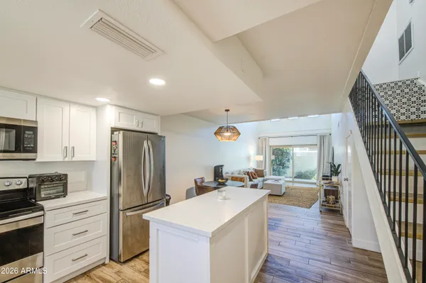 a view of a livingroom with furniture and wooden floor