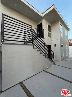 a living room with a fireplace furniture and a flat screen tv