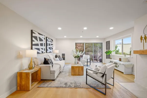 a living room with furniture and a large window