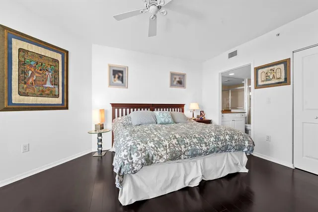 a view of a building with a garden and sitting area