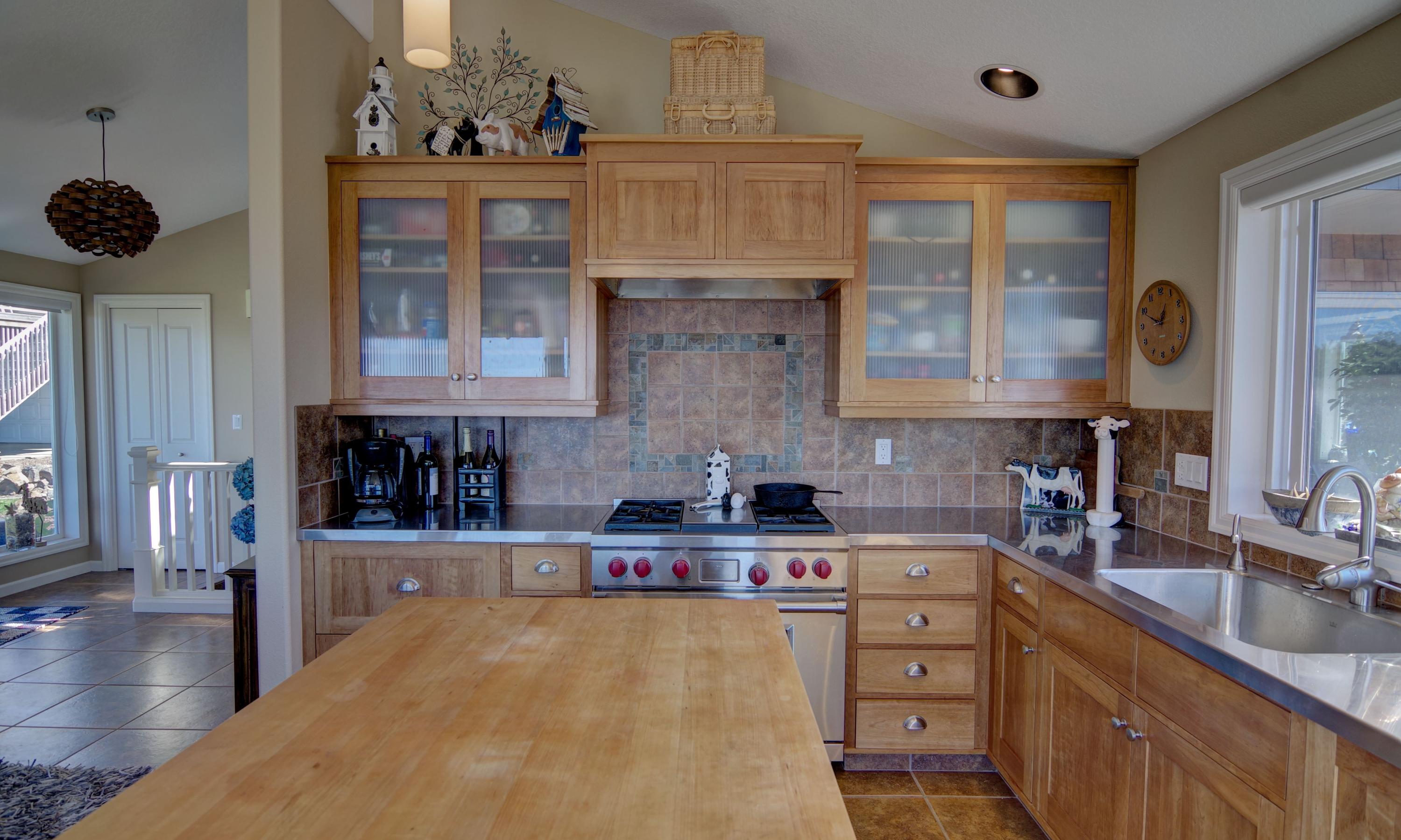 1065 Arthurs Road Oceanside, OR 97141 - Photo 17 of 47 a kitchen with a stove a sink and cabinets