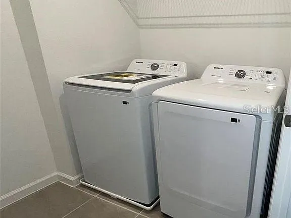 a utility room with dryer and washer