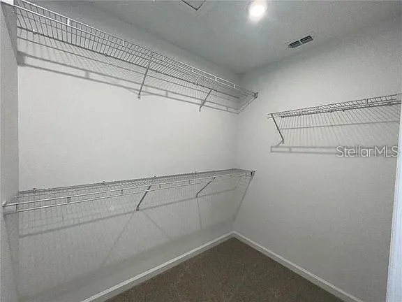 a view of a room with racks on the wall