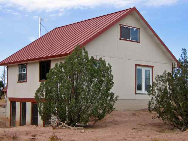 4488 Jay Road Snowflake, AZ 85937 - Photo 4 of 5 a front view of a house with garden