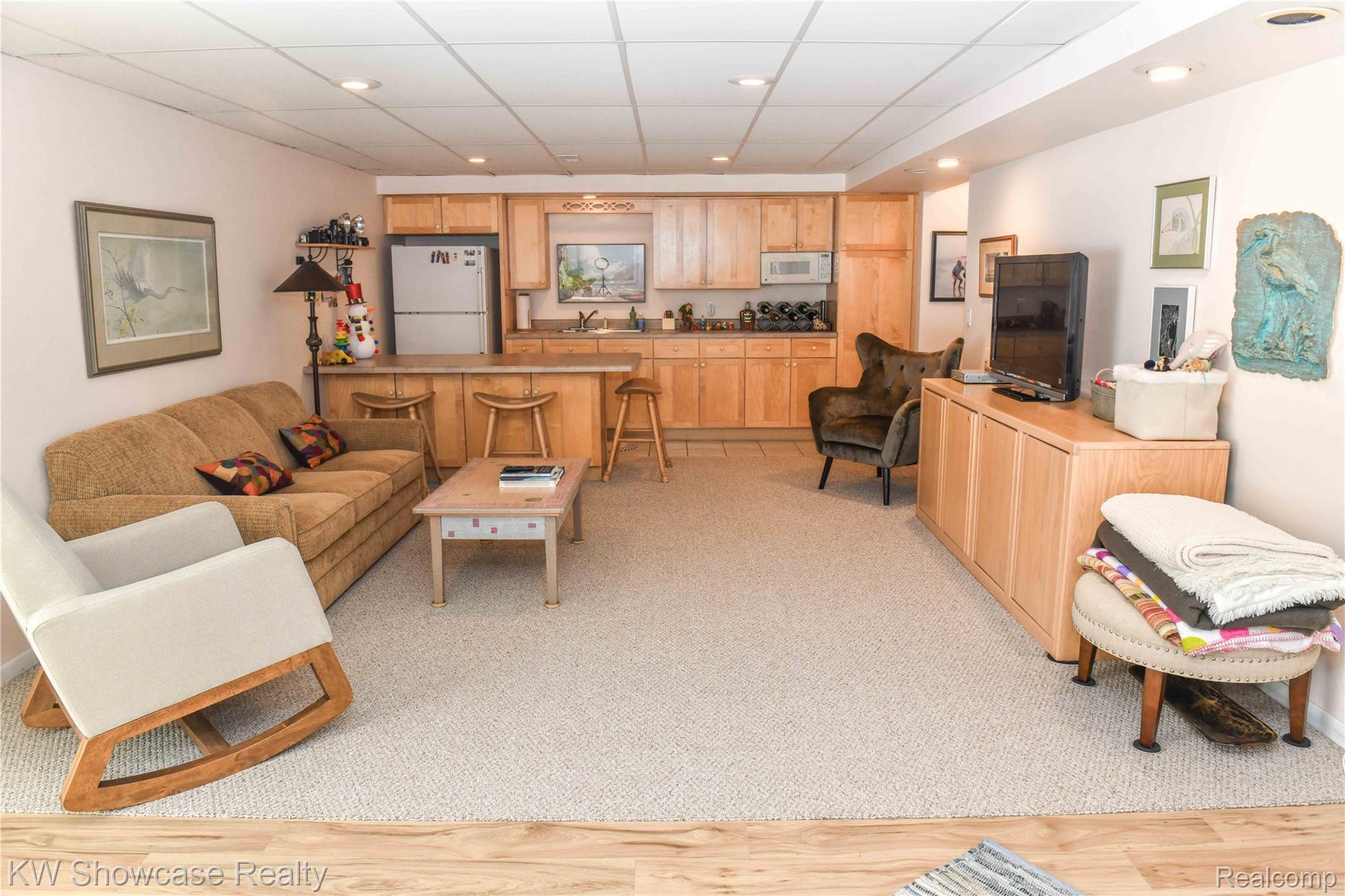 3559 Timber Ridge Drive Metamora, MI 48455 - Photo 31 of 35 Basement living room with a paneled ceiling, recessed lighting, and light colored carpet