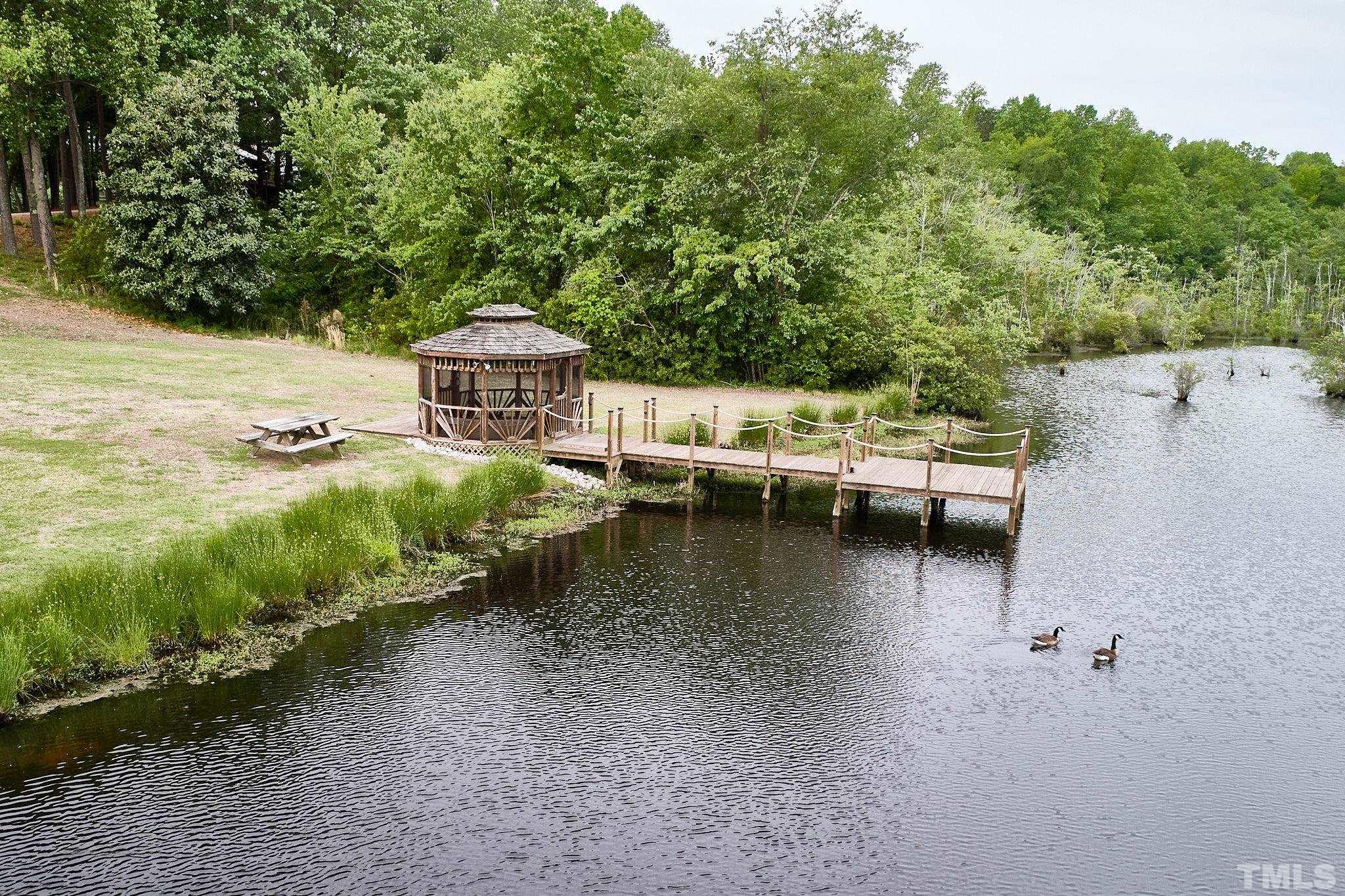 6371 Morningside Road Wilson, NC 27893 - Photo 54 of 57 an aerial view of a house with outdoor space lake view and boat